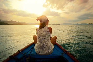 woman traveling by boat