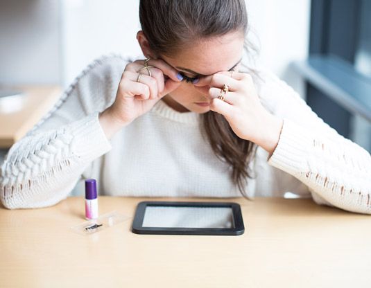 putting on false eye lashes.jpeg